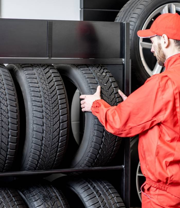 Worker taking new tires